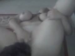 Busty slut rubs her pussy while getting dog oral sex
